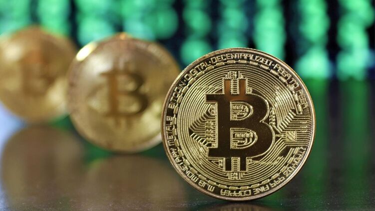 Стоимость биткоина могла также вырасти на фоне рекордной ликвидации коротких позиций по криптовалюте. Фото: РИА Новости 